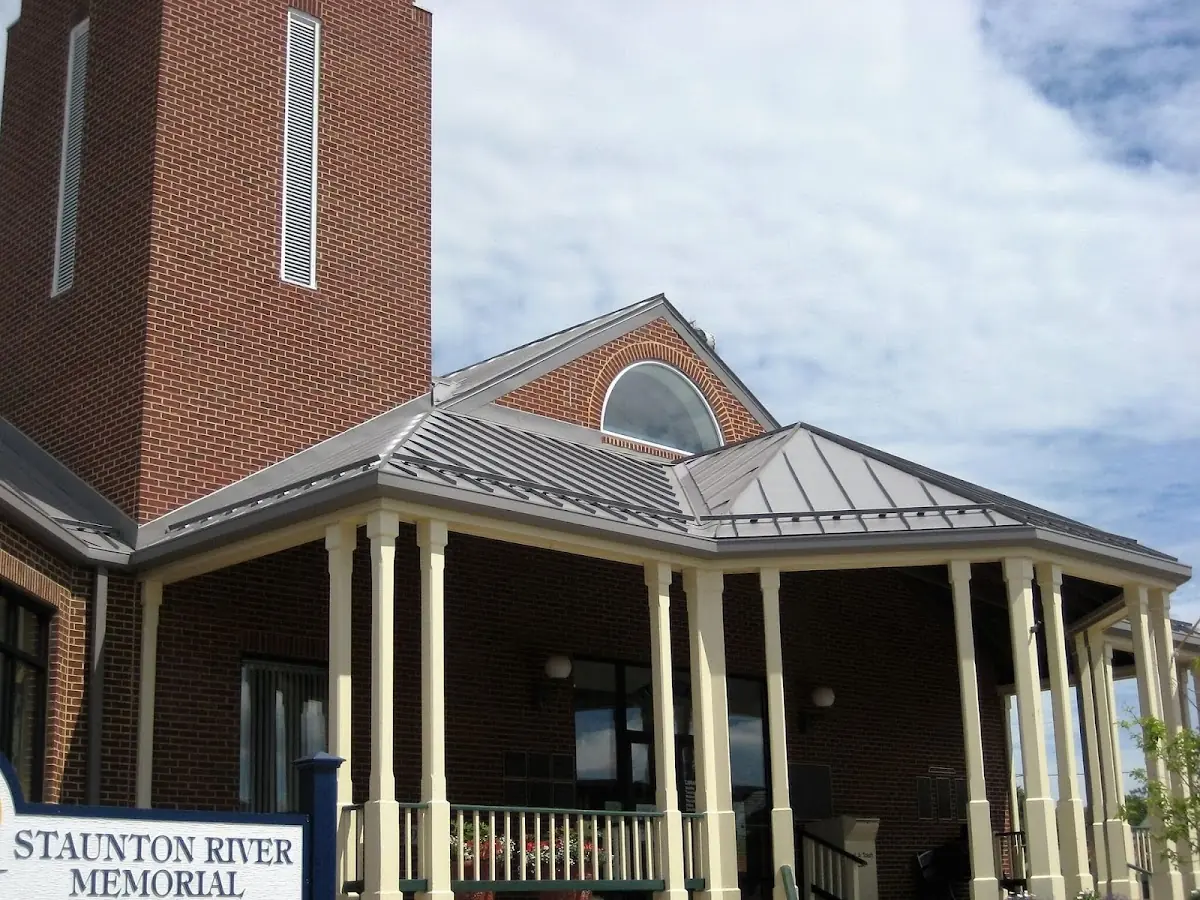 Skilled roofing craftsmen working on a residential roof in Penn
